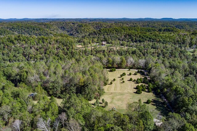 birds eye view of property with a forest view