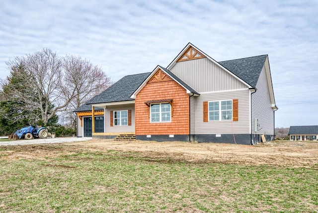 view of front of property featuring board and batten siding, crawl space, roof with shingles, and a front lawn