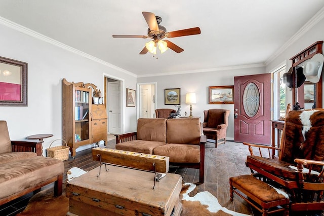 living area with dark wood-style floors, ceiling fan, baseboards, and crown molding