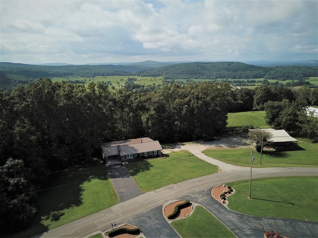 drone / aerial view with a mountain view and a forest view