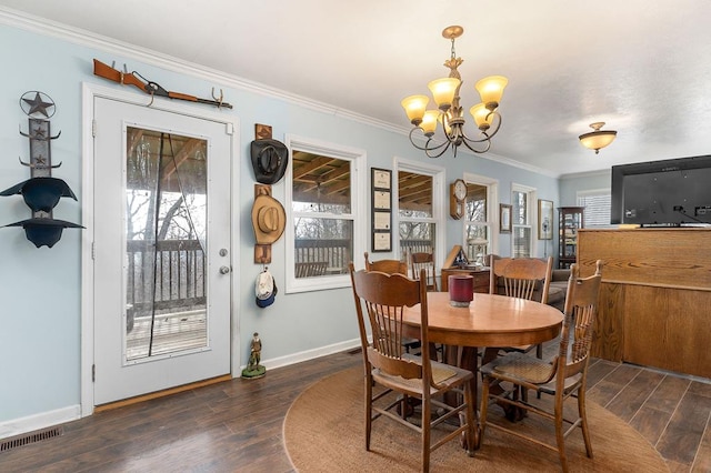 dining space with plenty of natural light, dark wood finished floors, and crown molding