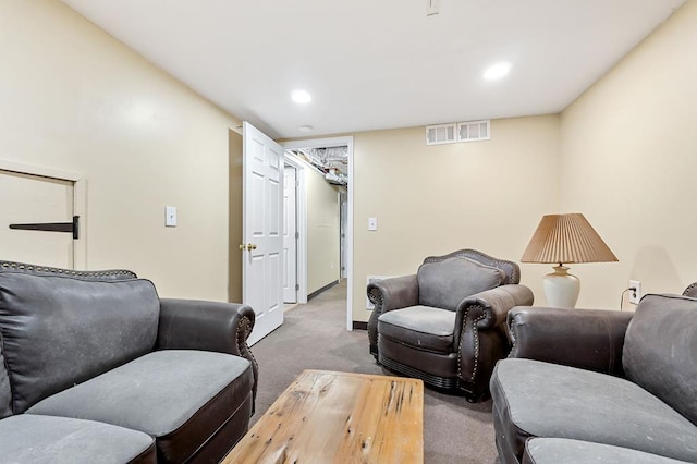 carpeted living room with recessed lighting and visible vents