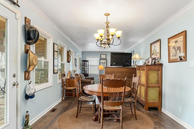 dining area featuring a chandelier, visible vents, baseboards, dark wood finished floors, and crown molding