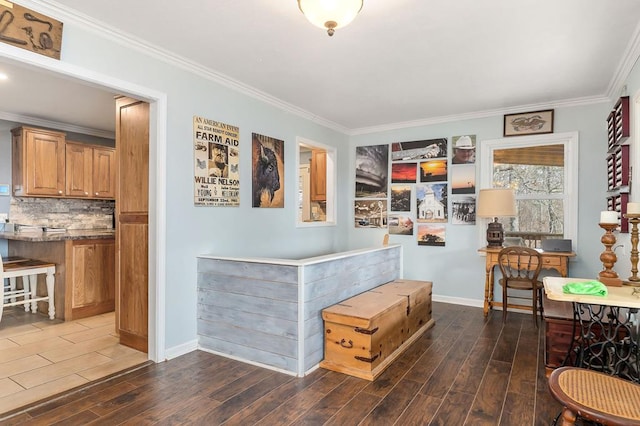 interior space featuring crown molding, baseboards, dark wood finished floors, and decorative backsplash