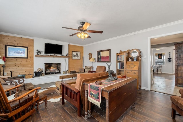 bedroom with ornamental molding, a brick fireplace, dark wood-style flooring, and baseboards