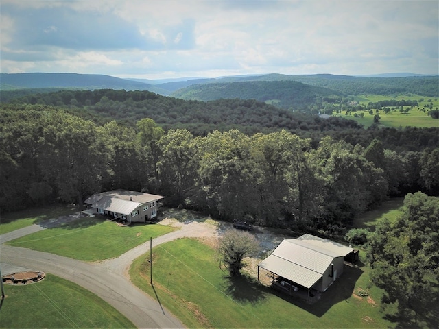 bird's eye view with a mountain view and a view of trees