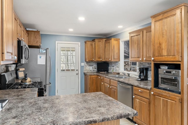 kitchen with crown molding, recessed lighting, backsplash, appliances with stainless steel finishes, and a sink