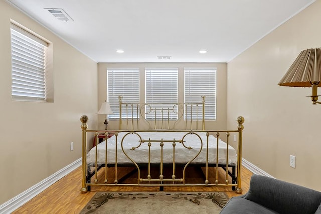 office space with baseboards, visible vents, wood finished floors, and recessed lighting