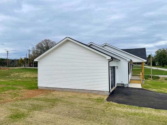 view of home's exterior featuring a lawn