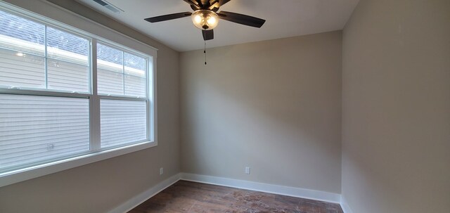 spare room featuring visible vents, ceiling fan, and baseboards