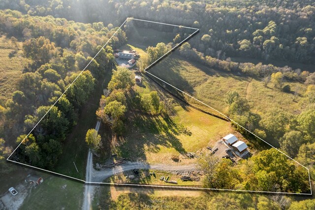 aerial view featuring a wooded view