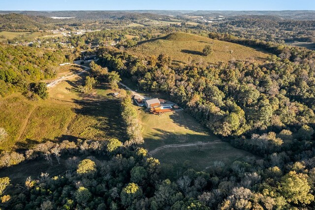 bird's eye view featuring a wooded view