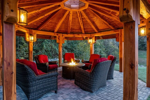 view of patio / terrace with an outdoor fire pit and a gazebo