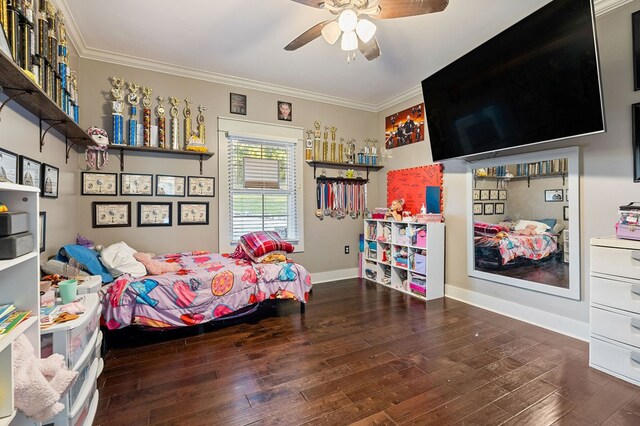 bedroom featuring dark wood-style floors, crown molding, baseboards, and a ceiling fan