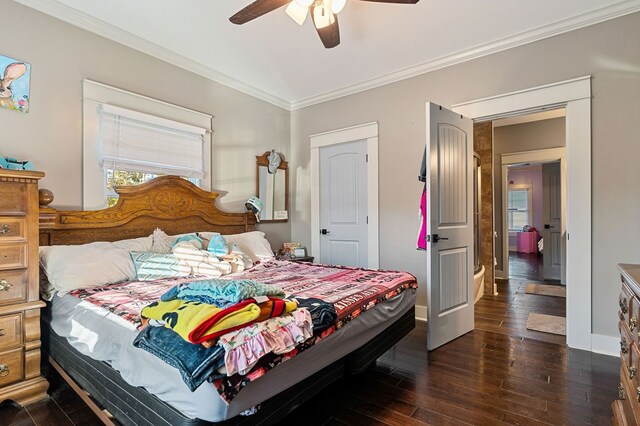 bedroom with dark wood-style floors, ornamental molding, a ceiling fan, and baseboards