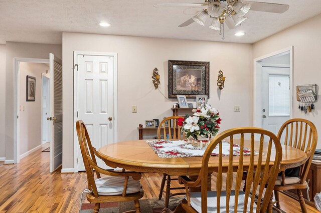 dining room with recessed lighting, light wood-style floors, ceiling fan, a textured ceiling, and baseboards