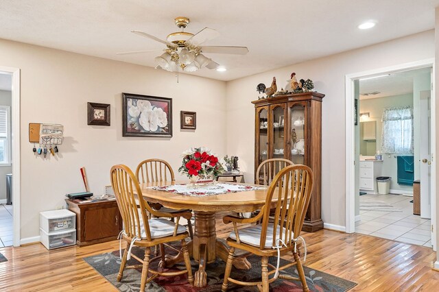 dining room featuring recessed lighting, light wood-type flooring, a ceiling fan, and baseboards