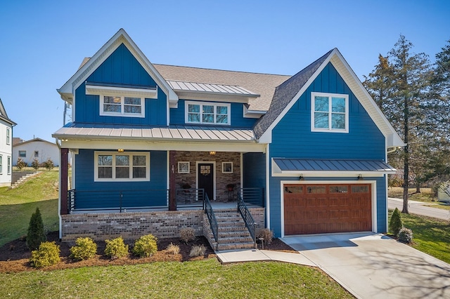 view of front of home featuring a standing seam roof, a porch, an attached garage, concrete driveway, and board and batten siding