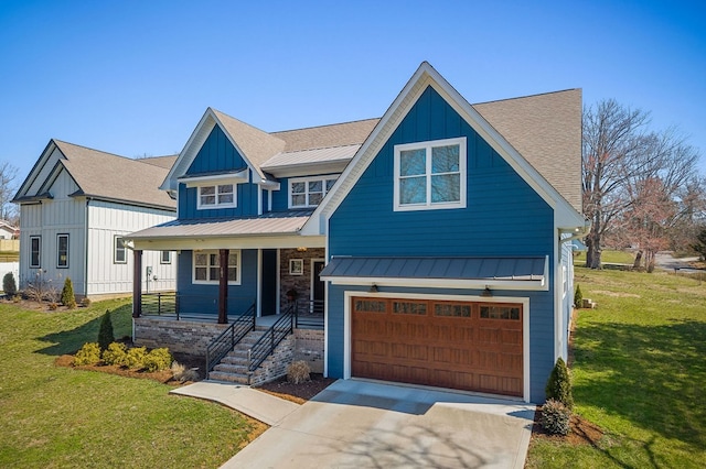 view of front of property with a front lawn, a standing seam roof, a porch, board and batten siding, and a garage