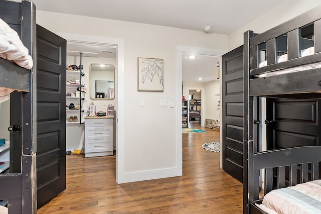 foyer featuring wood finished floors and baseboards