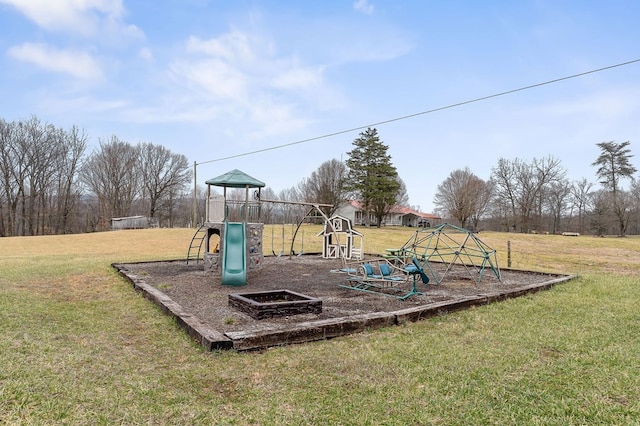 community playground featuring a lawn