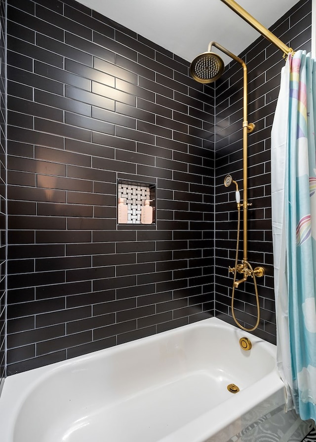 bathroom featuring shower / bath combo with shower curtain