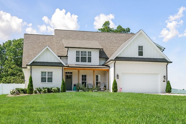 modern farmhouse with a porch, board and batten siding, a front yard, and fence