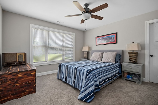 bedroom featuring carpet floors, visible vents, ceiling fan, and baseboards