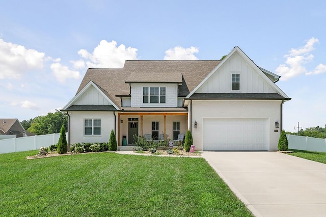 modern inspired farmhouse featuring fence, board and batten siding, and a front yard