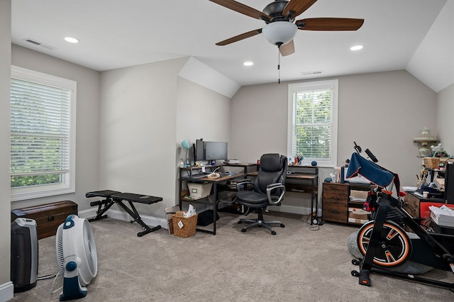 home office with lofted ceiling, carpet flooring, and visible vents