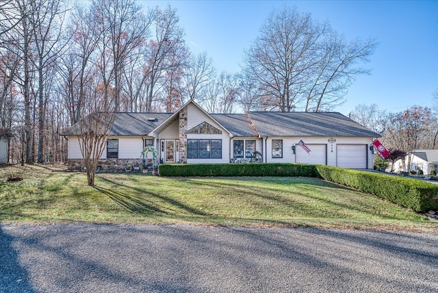 ranch-style home with a garage, stone siding, and a front lawn