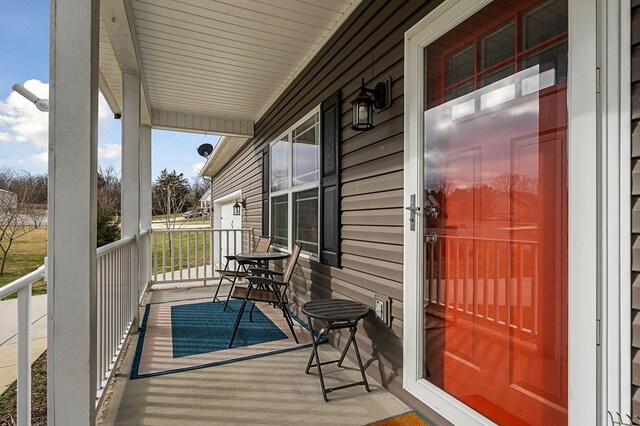 wooden terrace with a porch