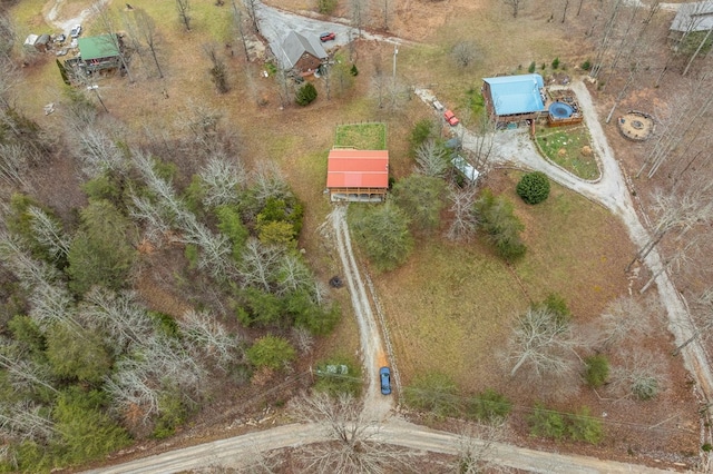 birds eye view of property with a rural view