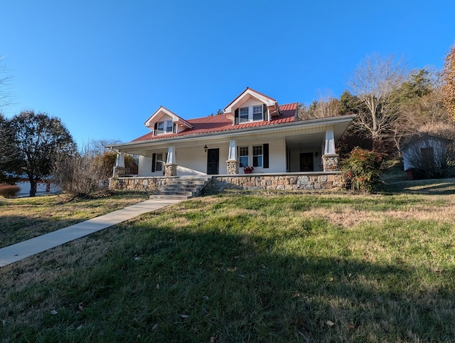 view of front of property featuring covered porch and a front lawn