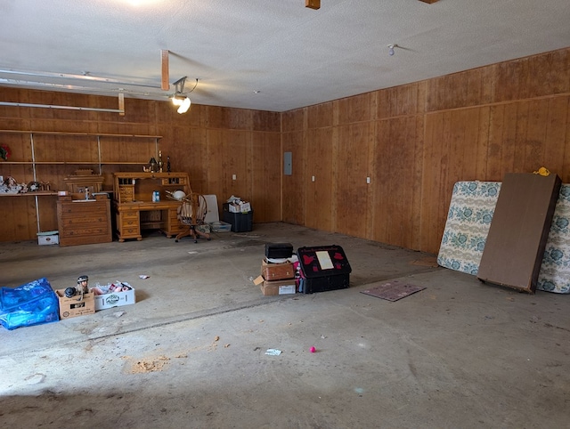 garage featuring wooden walls