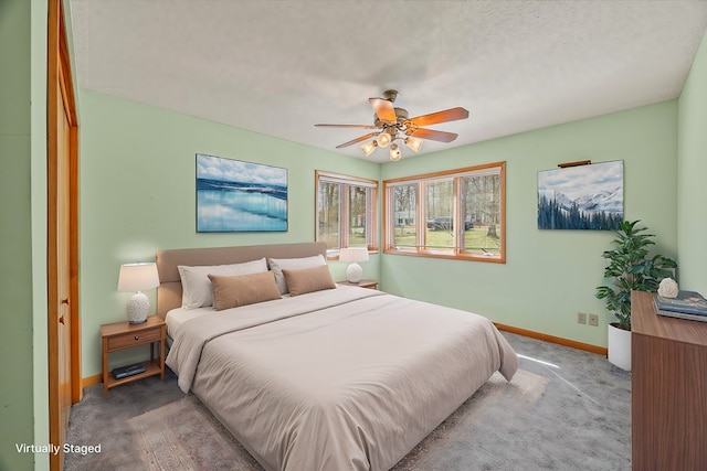 bedroom featuring carpet flooring, ceiling fan, and baseboards