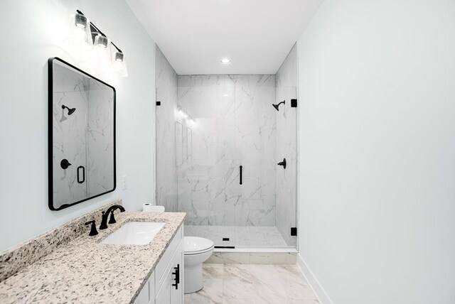 full bath with toilet, vanity, baseboards, marble finish floor, and a marble finish shower