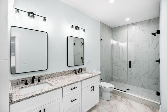 full bath with marble finish floor, a marble finish shower, and a sink