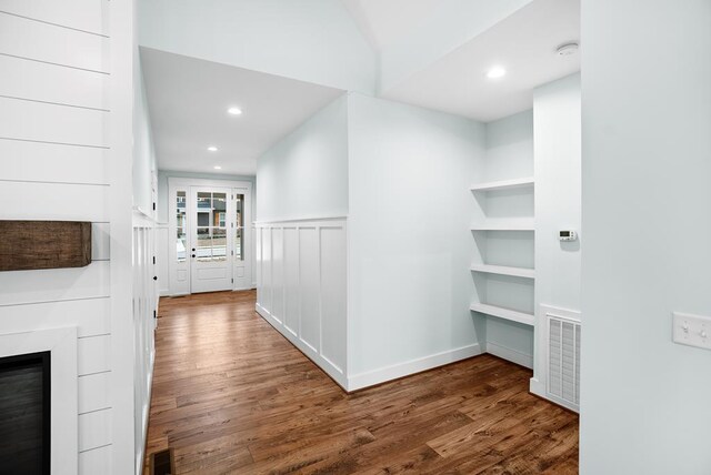 hallway featuring dark wood-type flooring, recessed lighting, and visible vents