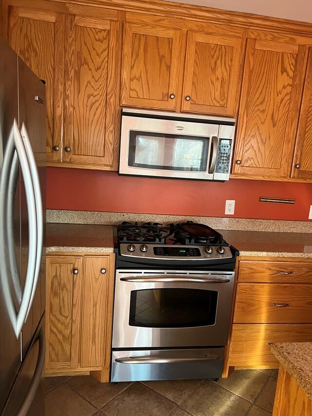 kitchen featuring brown cabinets and stainless steel appliances