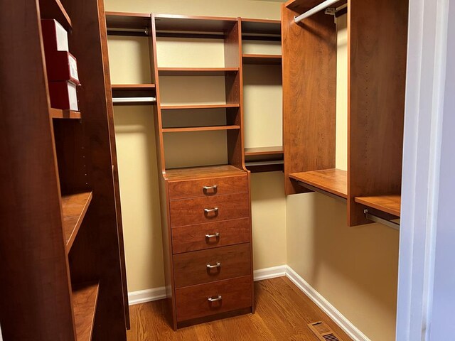 spacious closet with visible vents and wood finished floors