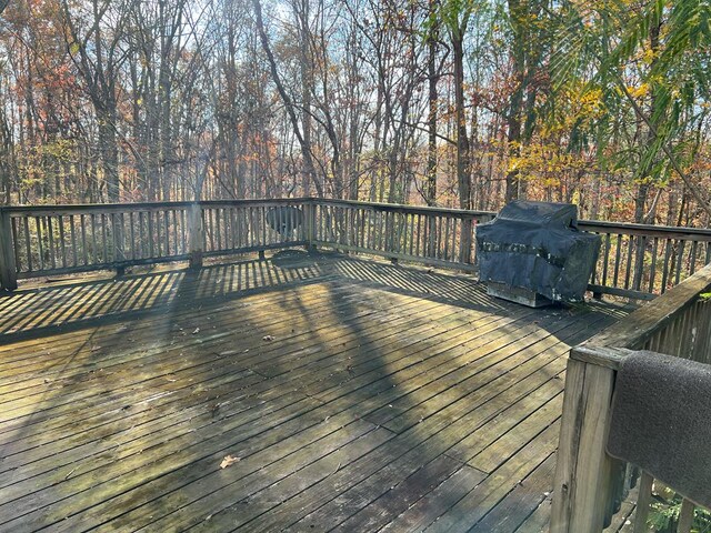 wooden deck featuring grilling area