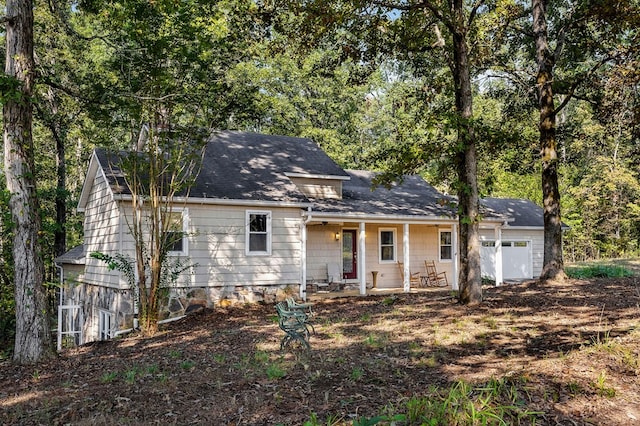 view of front of property featuring a garage and covered porch