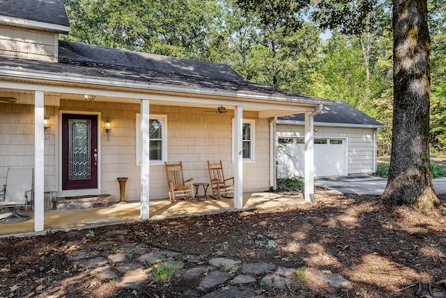 exterior space featuring a porch and roof with shingles