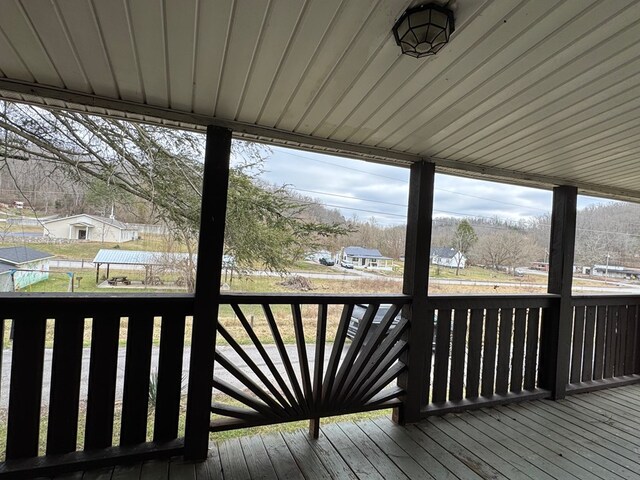 wooden deck featuring a residential view