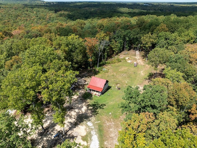 drone / aerial view featuring a view of trees