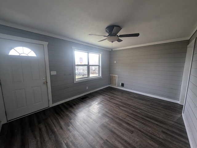 foyer entrance featuring a ceiling fan, baseboards, visible vents, and dark wood-style flooring