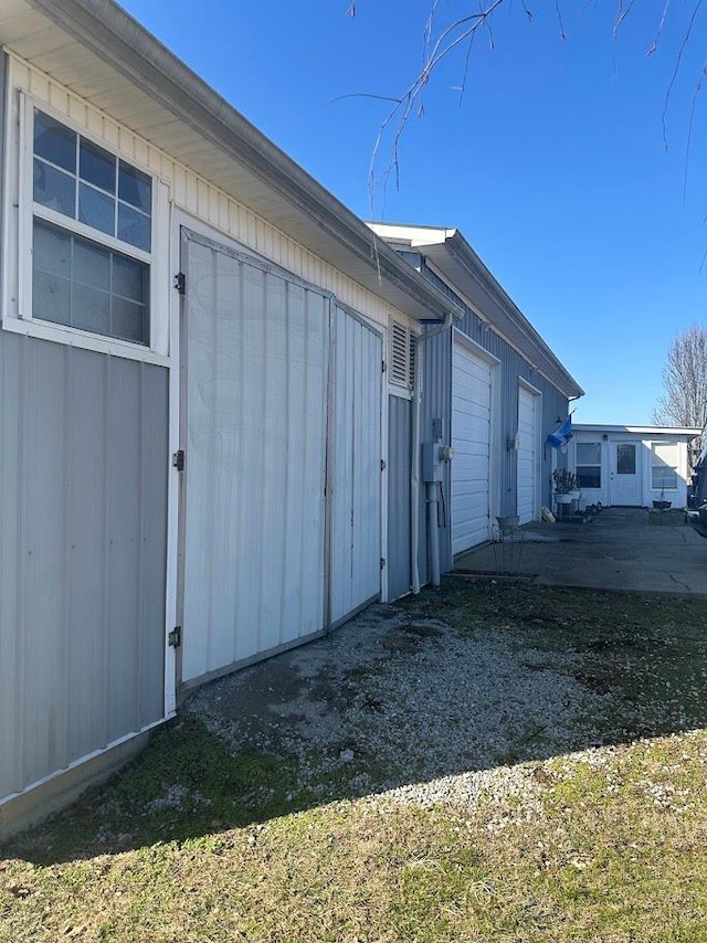 view of side of property with a garage