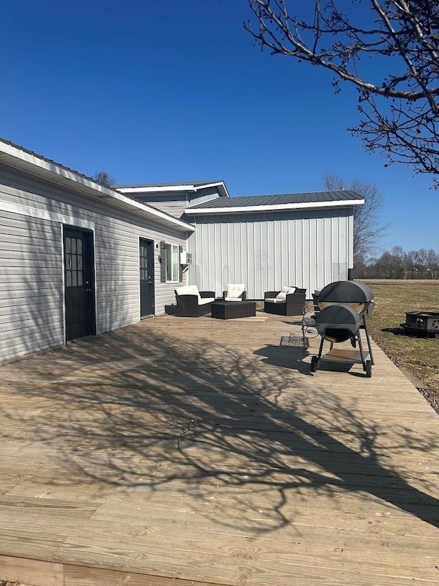 view of home's exterior featuring metal roof and outdoor lounge area