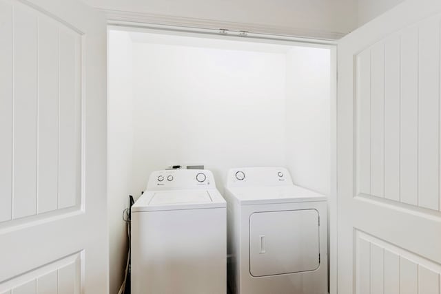 laundry area with laundry area and washer and clothes dryer